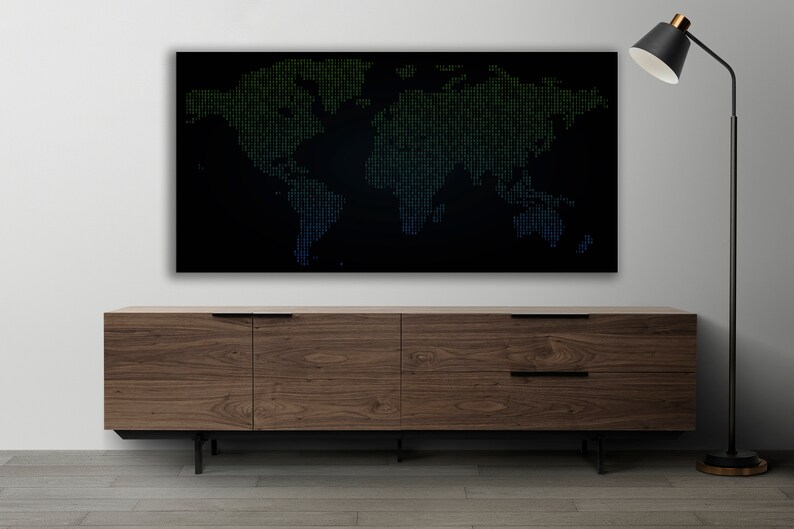 May include: A dark wood media console with two drawers and four legs. A black framed world map with green and blue dots is hanging above the console. A black floor lamp with a black shade is in the corner of the room.