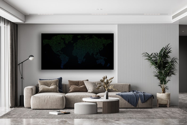 May include: A modern living room interior with a grey sectional sofa, two round coffee tables, a potted plant, and a black framed world map print on the wall. The map is made up of small green and blue squares.
