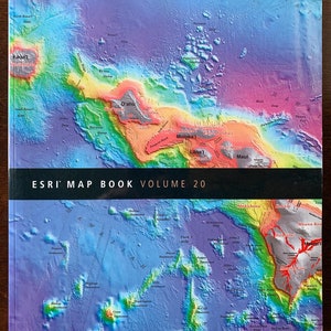 May include: A colorful map of the Hawaiian Islands, showing the topography of the islands and the surrounding ocean. The map is titled "ESRI MAP BOOK VOLUME 20".