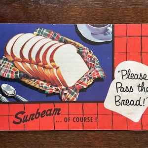 May include: Vintage Sunbeam bread advertisement featuring a basket of sliced white bread on a red and white checkered tablecloth. The text reads "Please Pass the Bread!" and "...of course!"