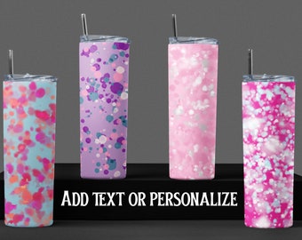 May include: Four stainless steel tumblers with different colorful abstract patterns. The tumblers are on a black display stand with the text "ADD TEXT OR PERSONALIZE".