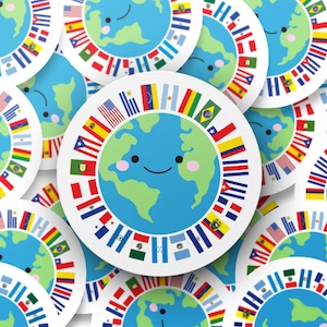 May include: A collection of colourful round stickers featuring a cartoon earth with a smiling face surrounded by flags from different countries. The earth is blue and green with pink cheeks.