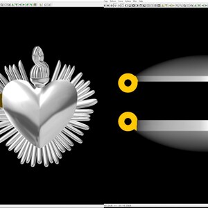 May include: Silver pendant featuring a heart with a crown and a halo of rays. The pendant is shown from the front and side views. The pendant is on a black background.