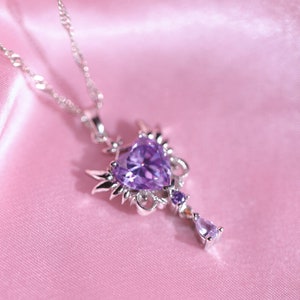 Enchanting Anime Inspired Necklace - Unique Purple Heart Pendant with Wing Details and Swinging Drop