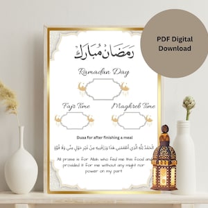 May include: A framed digital print with Arabic calligraphy and English text, including "Ramadan Mubarak" and "Ramadan Day." The design features decorative elements and space for time tracking. A PDF digital download.