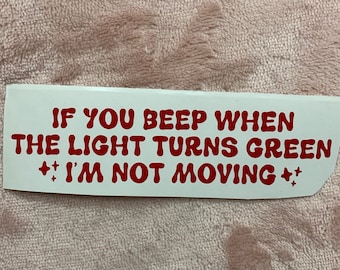 May include: White sticker with red text that reads "If you beep when the light turns green ++ I'm not moving ++".