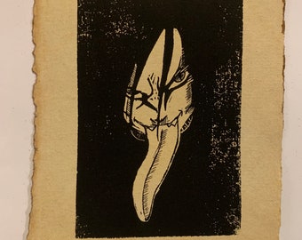 May include: Black and white print of a stylized face with a long, pointed tongue. The face is partially obscured by a dark background.