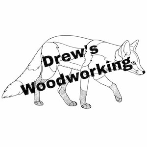 May include: A black and white line drawing of a fox walking. The fox's body is segmented, with a decorative pattern on its legs. The text "Drew's woodworking" is written across the fox's body.