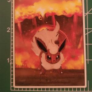 May include: A brown and white Eevee Pokemon standing in a fiery orange and yellow background. The Eevee is surrounded by flames and smoke.