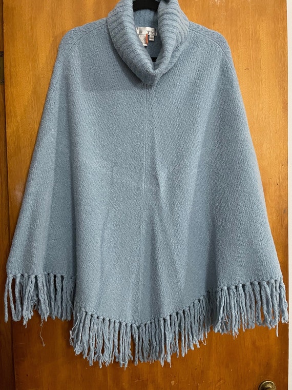 Fringed poncho sweater