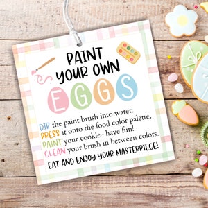 May include: A printable Easter activity card with a colourful checkered background. The card features a paintbrush, a palette of paint, and the text "PAINT YOUR OWN EGGS". Instructions for decorating eggs are listed below the title.