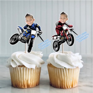 May include: Two cupcake toppers featuring a cartoon image of a child riding a dirt bike. The toppers are printed with the text "I am able to add any number!"