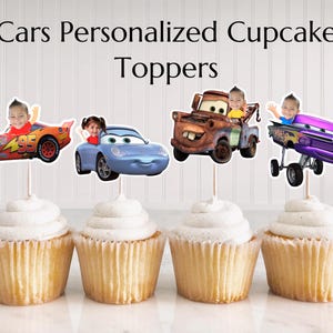 May include: Four cupcakes topped with personalized Cars-themed toppers. Each topper features a different character from the movie, with a child's face in the car. The text "Cars Personalized Cupcake Toppers" is displayed at the top.