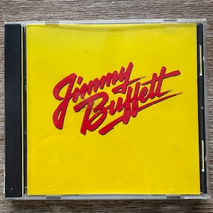 Songs You Know By Heart: Jimmy Buffet’s Greatest Hits. Classic CD w/ “Margaritaville” and “Volcano”. FREE SHIPPING!