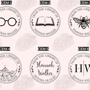 May include: Six black and white round rubber stamps with different designs. Each stamp says "From the Library of Hannah Walker" with a different design in the center. The designs are: glasses, a book, a bee, a mountain, the name "Hannah Walker" and the initials "HW".