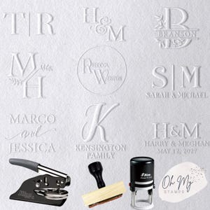 May include: White embossed paper with various custom stamp designs. Includes initials, names, and family names. Features a black and silver embosser, a wooden stamp, and a self-inking stamp. The text "Oh My STAMPS" is also visible.