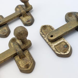 May include: A set of three ceramic mugs with a speckled, matte finish. The mugs are in shades of cream, light gray, and dark gray. Each mug has a simple, minimalist design, perfect for coffee or tea.