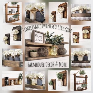 May include: A collection of farmhouse style wall decor featuring shelves, mason jars, and greenery. The shelves are made of rustic wood and have a distressed finish. The mason jars are decorated with white flowers and twine. The greenery is a mix of eucalyptus and succulents. The sign reads "Happy Home".
