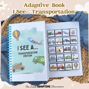 May include: An open adaptive book with a blue spiral binding. The cover reads "I SEE A... TRANSPORTATION EDITION" with illustrations of a hot air balloon, airplane, school bus, and a recycling truck. The right page displays transportation-themed picture cards.