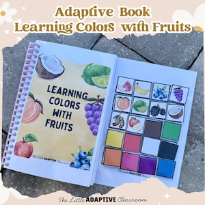 May include: An open spiral-bound book titled "Learning Colors with Fruits." The cover features illustrations of fruits like a coconut, lime, grapes, and an apple. The right page displays color blocks with fruit illustrations.