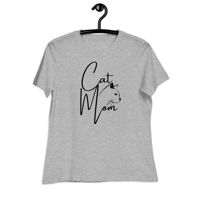 May include: Grey t-shirt with the text "Cat Mom" in black script with a cat silhouette.