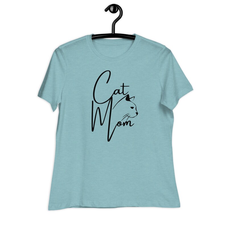 May include: A light blue t-shirt with the text "Cat Mom" in black script with a black cat silhouette.