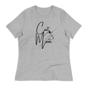 May include: A heather grey t-shirt with a black graphic that says "Cat Mom" with a stylized cat head silhouette.