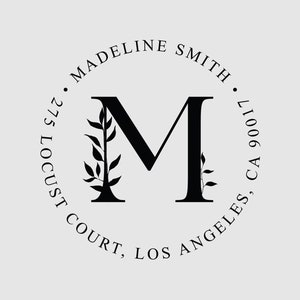 May include: Black and white monogram logo with the letter M in a circle. The text around the circle reads "Madeline Smith, 275 Locust Court, Los Angeles, CA 90017".