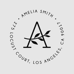May include: Black and white circular stamp with the text "Amelia Smith" and "275 Locust Court, Los Angeles, CA 90017". The letter "A" with a stylised branch is in the centre of the circle.