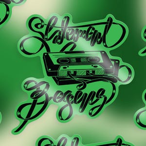 May include: Black and green sticker with a cassette tape and the text "Statement Designs" in a stylized font.