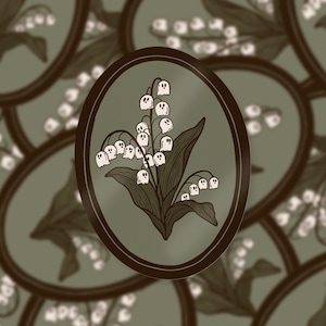Op de afbeelding: Een ovale sticker met een gedetailleerde illustratie van lelietjes-van-dalen bloemen. De bloemen zijn wit met donkerbruine stelen en bladeren, tegen een gedempte groene achtergrond in een donkerbruine ovale lijst. Het ontwerp wordt herhaald.