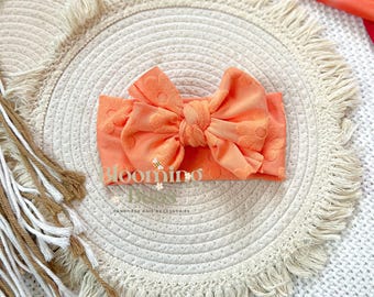Orange daisy knit knotted headband I Handmade baby and toddler hair bows