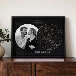 May include: A black framed wall art print featuring a circular black and white photograph of a couple next to a circular star map. Text reads OCTOBER 15, 2025, ADELAIDE, AUSTRALIA, -34.9244° S 138.5995° E, and the phrase THE NIGHT WE MET.