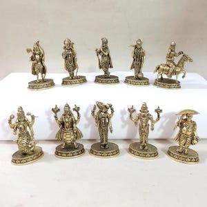 May include: Set of ten gold-toned metal figurines depicting Hindu deities. The figurines are detailed and feature intricate designs.