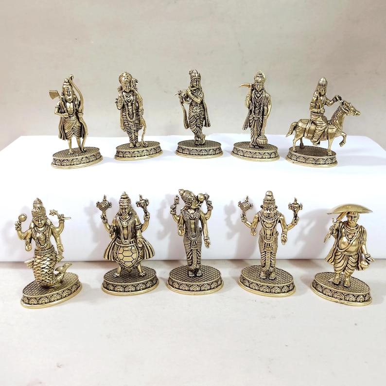 May include: Set of ten gold-toned metal figurines depicting Hindu deities. The figurines are detailed and feature intricate designs.