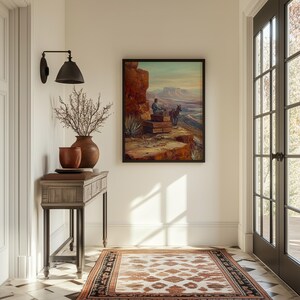 May include: A rustic wooden console table with a brown top and black metal legs. The table is decorated with a vase of dried branches, two terracotta pots, and a framed painting of a person sitting on a rock with a donkey. The painting is set against a desert landscape.