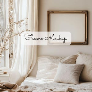 May include: A gold picture frame with ornate detailing hangs on a white wall above a bed with white linen bedding and pillows. The text "Frame Mockup" is written in black cursive on a white rectangle.