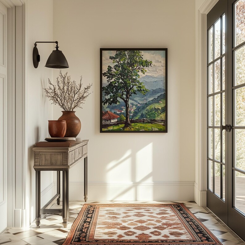 May include: A wooden console table with a brown top and black metal legs. The table is decorated with a vase of dried branches and a painting of a green tree in a landscape setting.
