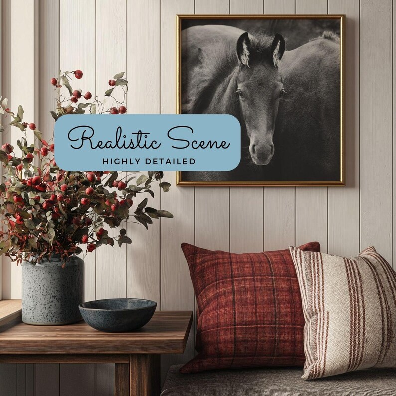 May include: A black and white photograph of a horse's head in a gold frame hanging on a white wood wall. The wall is decorated with a vase of red berries and a plaid pillow.