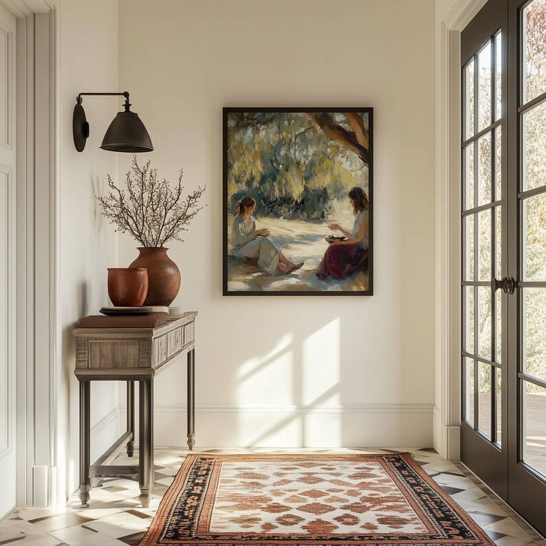 May include: A wooden console table with a brown top and black metal legs. The table is decorated with a vase of dried branches and a painting of two women sitting under a tree.