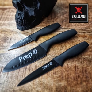 May include: Three black kitchen knives with black handles. The knives are labelled "Dice", "Prep", and "Slice".