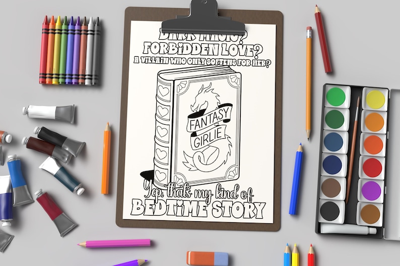 May include: A black and white printable coloring page featuring a book with a dragon on the cover. The book is titled "Fantasy Girlie" and the text reads "Dark Magic? Forbidden Love? A Villain Who Only Softens For Her? Yep, that's my kind of bedtime story."
