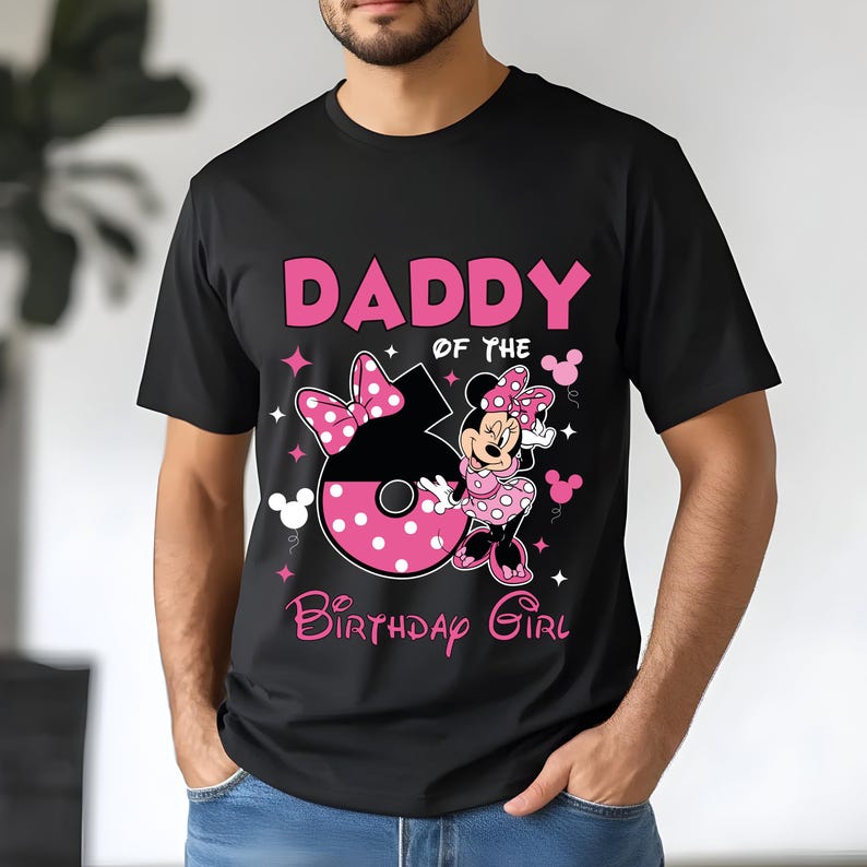 May include: Black t-shirt with a pink graphic that says "DADDY of the BIRTHDAY GIRL". The graphic includes a large number 6 with a pink bow and Minnie Mouse in a pink polka dot dress.