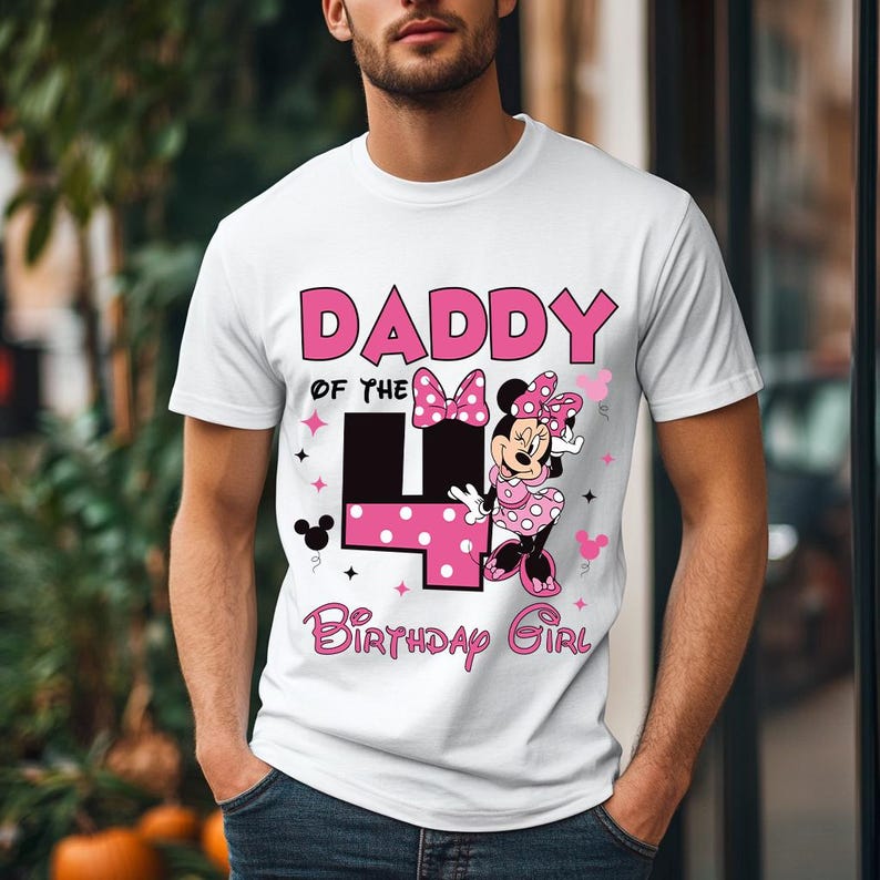 May include: White t-shirt with a pink graphic that says "DADDY of the 4 Birthday Girl". The number 4 is pink with white polka dots. Minnie Mouse is featured in a pink polka dot dress and bow.