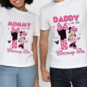 May include: White t-shirts with Minnie Mouse graphics. One shirt says "Mommy of the Birthday Girl" and the other says "Daddy of the Birthday Girl". Both shirts feature a large number 1 and Minnie Mouse.