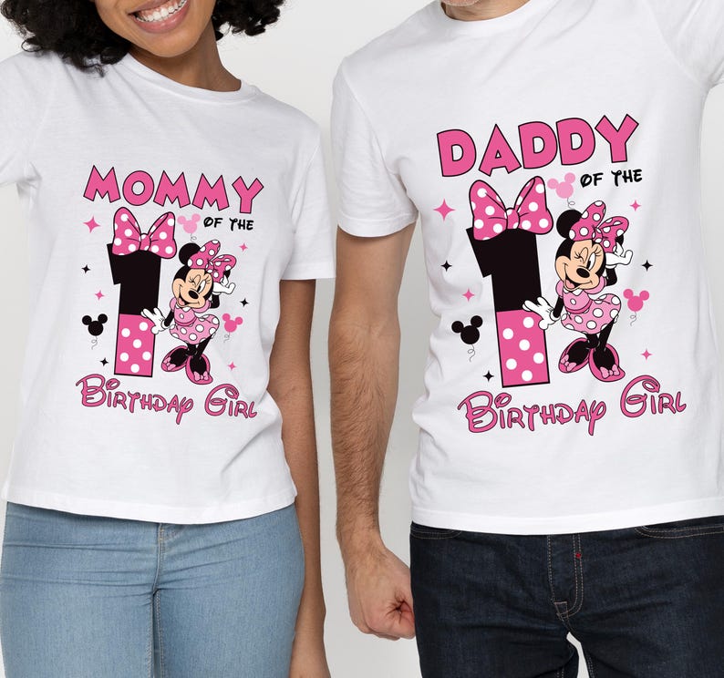 May include: White t-shirts with Minnie Mouse graphics. One shirt says "Mommy of the Birthday Girl" and the other says "Daddy of the Birthday Girl". Both shirts feature a large number 1 and Minnie Mouse.