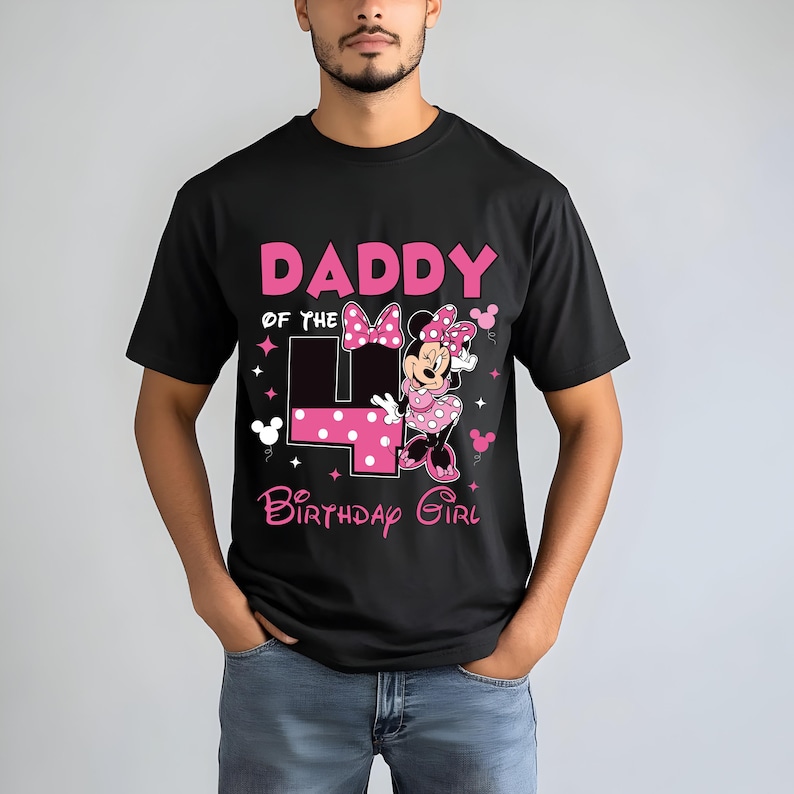 May include: Black t-shirt with a pink graphic that reads "DADDY of the 4 BIRTHDAY GIRL" featuring a Minnie Mouse design. The number 4 is in pink with white polka dots. The shirt is a short-sleeved crew neck.