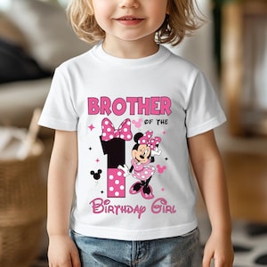 May include: White t-shirt with a pink and black graphic featuring Minnie Mouse and the text "Brother of the Birthday Girl." The number "1" is also featured in the design, along with polka dots and stars.