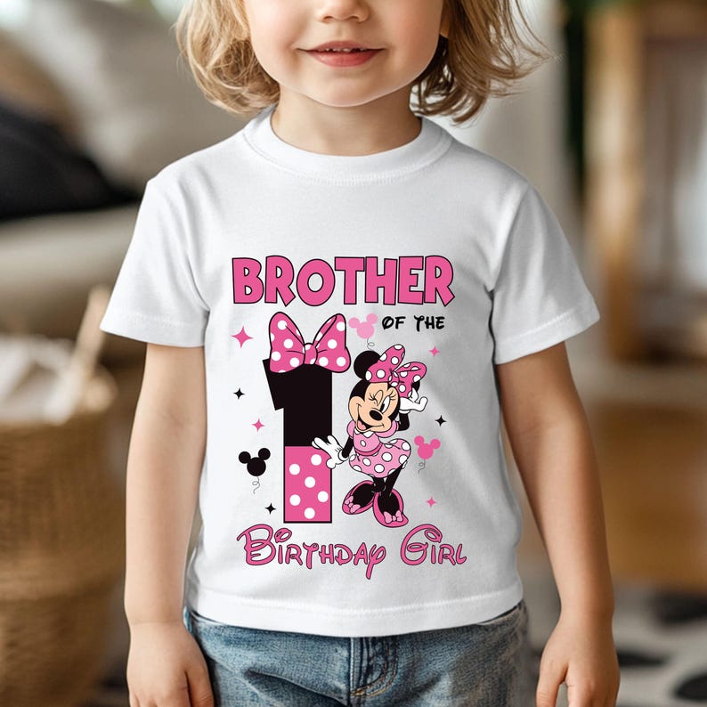 May include: White t-shirt with a pink and black graphic featuring Minnie Mouse and the text "Brother of the Birthday Girl." The number "1" is also featured in the design, along with polka dots and stars.