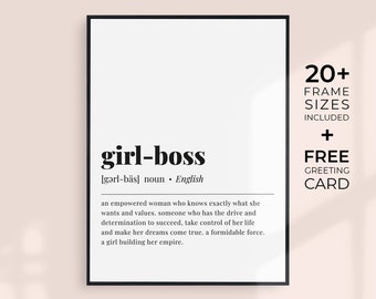 May include: A framed print with the words "girl-boss" in a bold, black font. The definition of "girl-boss" is included below the title. The print also includes the text "20+ frame sizes included + free greeting card."